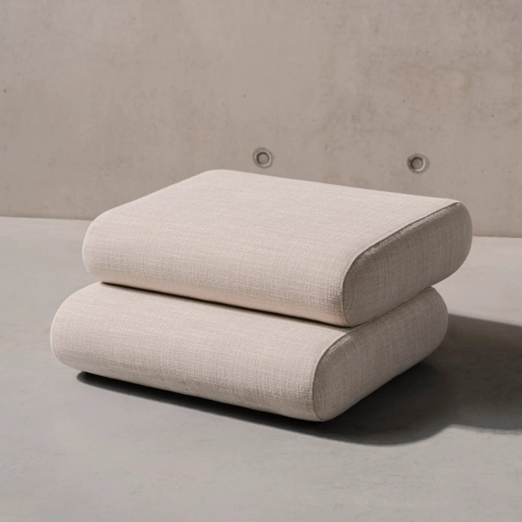 Taso Pouf in dark grey color, adding elegance to any room setting