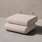 Taso Pouf in dark grey color, adding elegance to any room setting