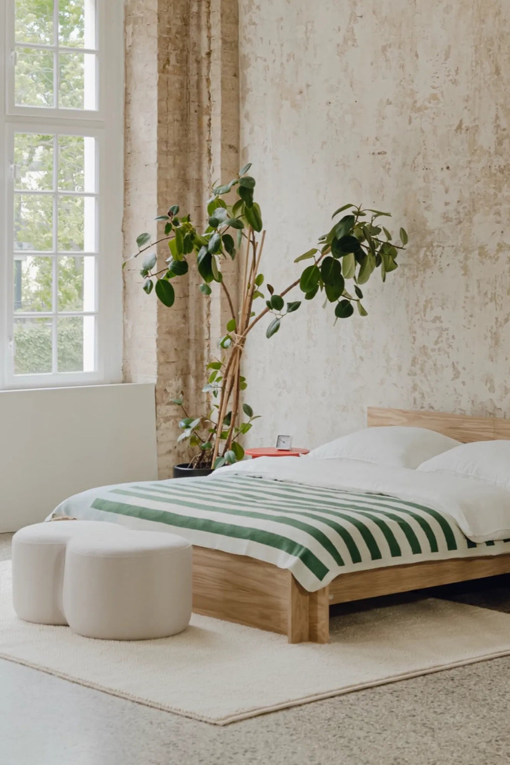 umbo pouf in cozy bedroom setting