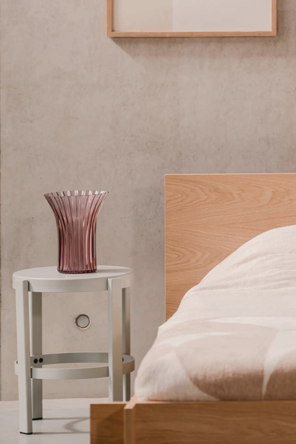 noo.ma Valt Bed, a modern minimalist bed frame crafted from light natural oak wood, featuring a clean rectangular headboard and sturdy, understated lines.