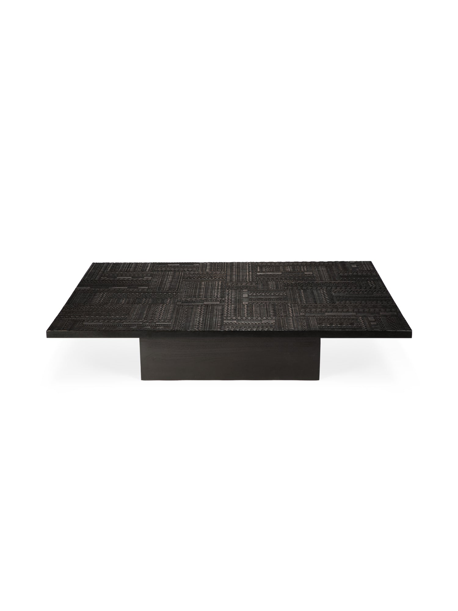 Ethnicraft Tabwa Coffee Table, a rectangular, dark teak wood coffee table with an intricately carved, textured surface pattern, resting on a solid, dark block base, exuding an elegant, artisanal aesthetic, displayed on a white background.