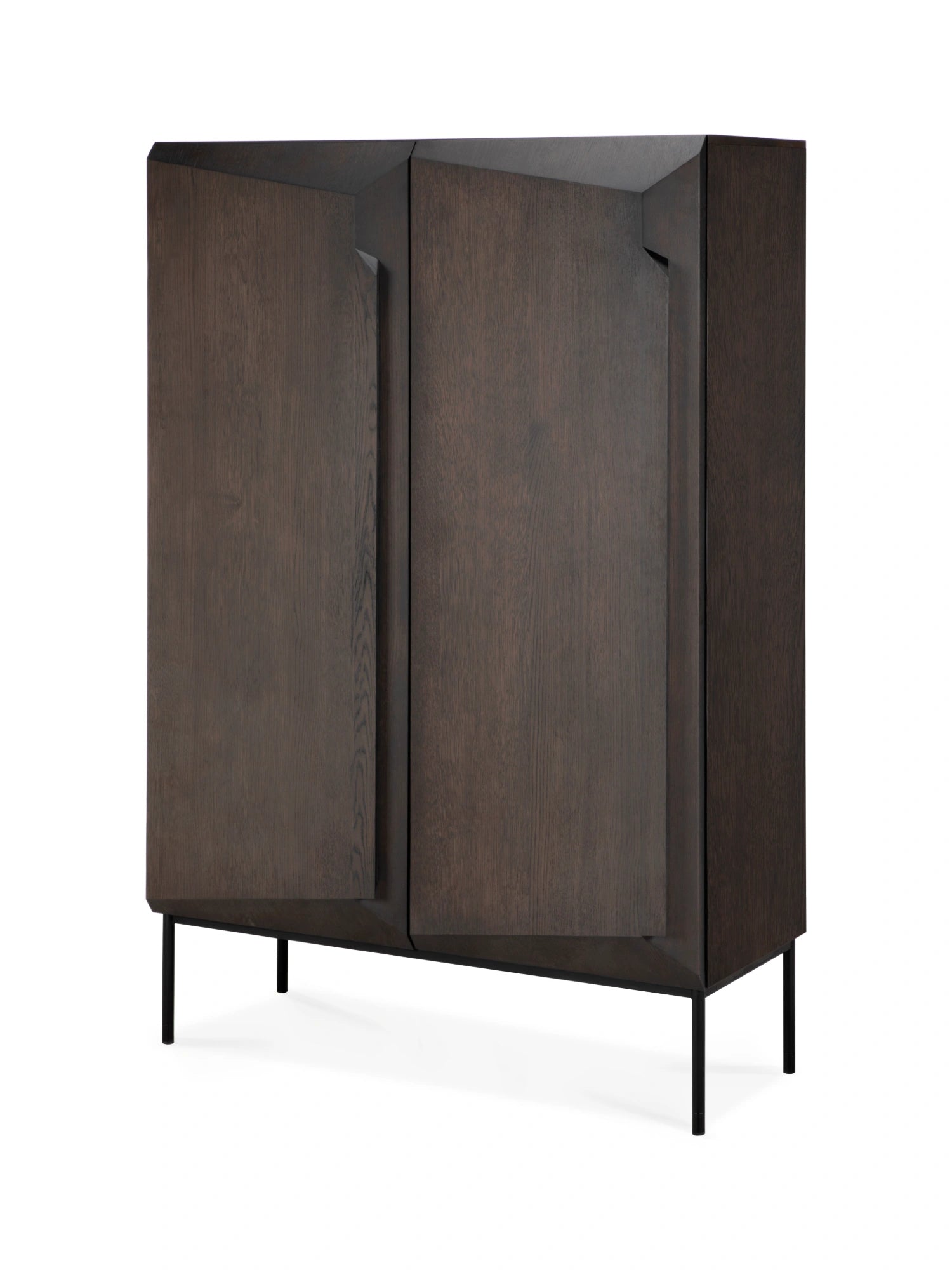 Ethnicraft Stairs Cupboard, a modern storage cabinet crafted from dark brown solid oak, featuring a distinctive geometric, faceted door design with visible wood grain.