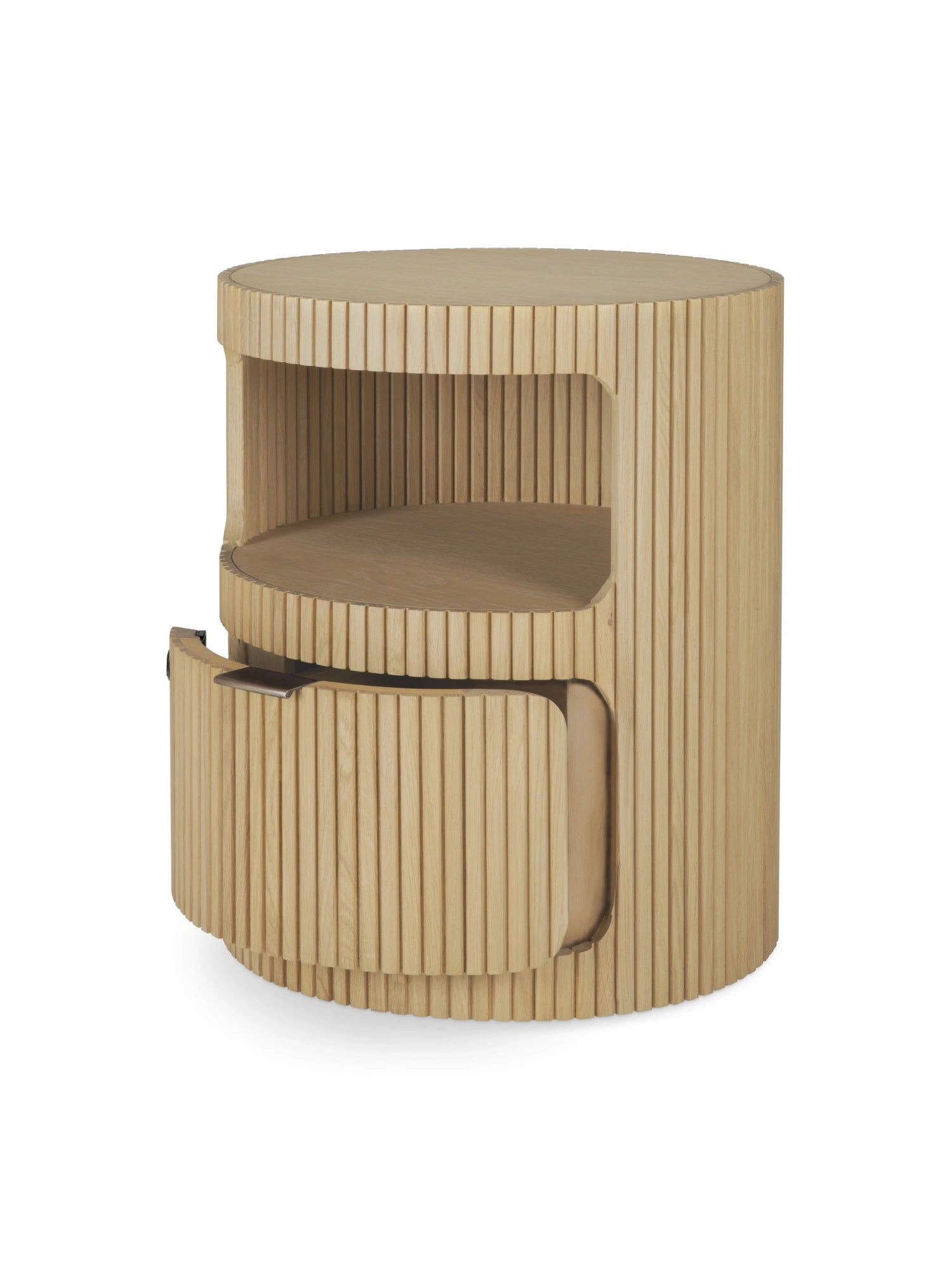 Ethnicraft Boomerang Drawer Unit, a cylindrical solid oak drawer unit featuring a natural light oak wood finish and a distinctive vertical fluted texture around its curved profile. It offers practical storage with an open shelf and a gently curved pull-out drawer, blending seamlessly into organic modern, minimalist, or Japandi-inspired interiors as a stylish bedside table or living room accent.