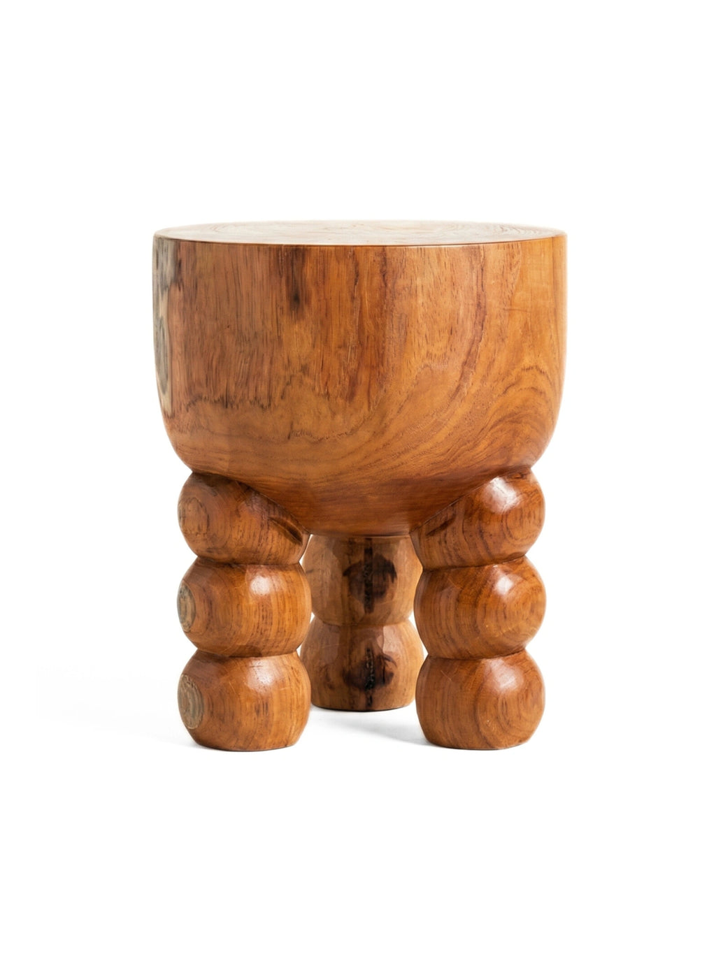 Heaps & Woods Alice Stool, a striking organic modern accent stool crafted from solid wood with a rich, warm natural brown finish and distinct grain. Its design features a thick, rounded cylindrical top supported by three chunky, sculptural legs, each composed of stacked, bulbous forms. This versatile wood stool is ideal as a unique side table or decorative element for contemporary living rooms, bedrooms, or entryways.