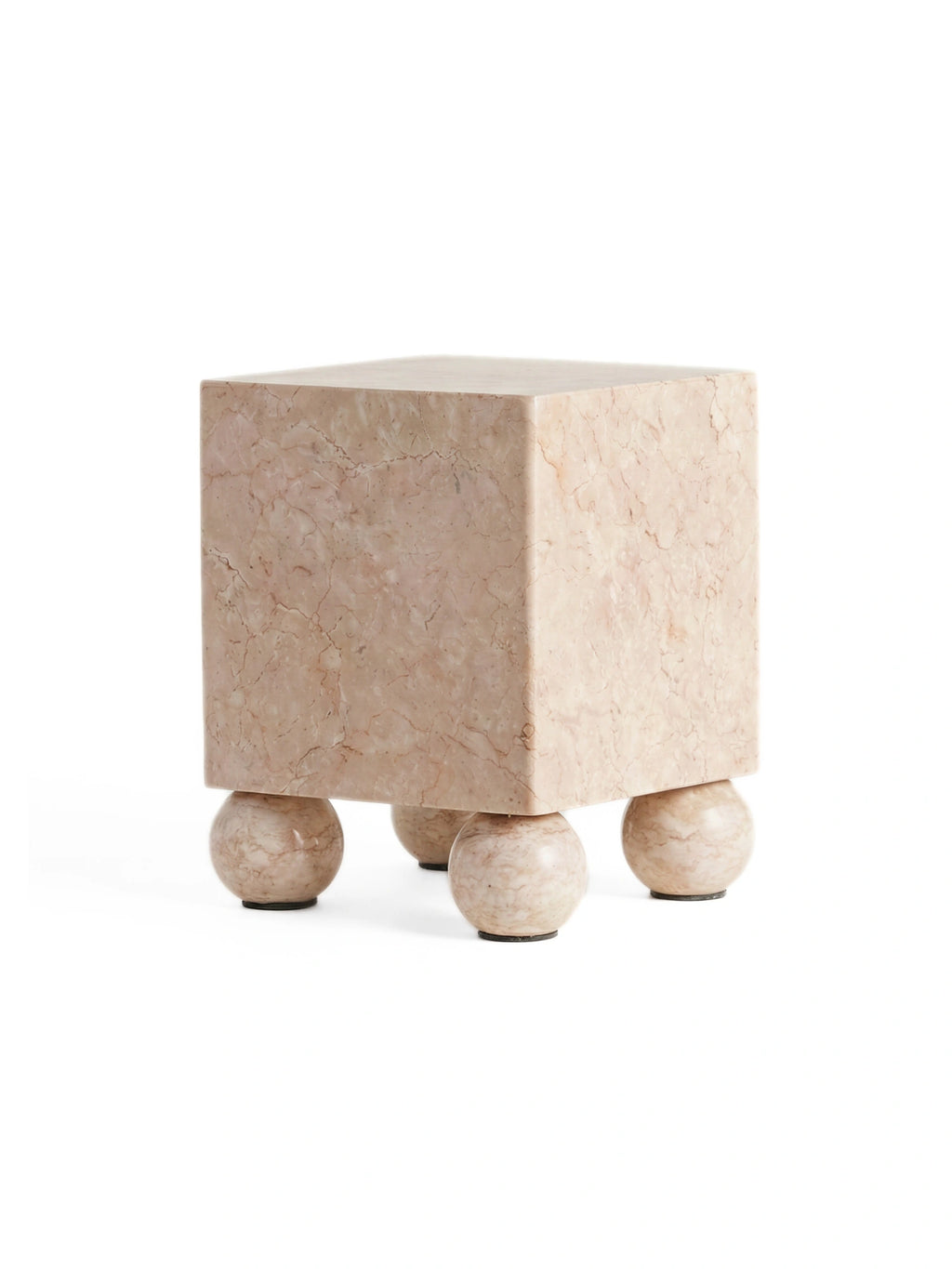 Heaps & Woods Aurelia Side Table, a contemporary sculptural side table crafted from natural pink and beige marble, featuring a solid cube-shaped top with intricate veining and four distinctive spherical ball legs. This organic modern marble accent table adds a touch of brutalist elegance and minimalist design, ideal for a chic living room, modern bedroom, or sophisticated entryway console.