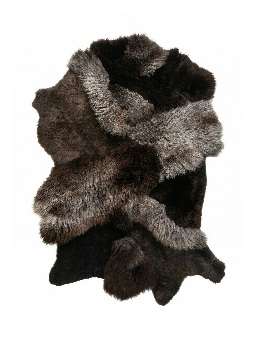 TCL Studios Brown Sheepskin Patchwork Rug, a luxurious multi-tone genuine sheepskin area rug featuring an organic patchwork design with varying shades of rich dark brown, warm taupe, and soft grey fur. This plush and shaggy natural sheepskin rug offers a rustic yet cozy accent for Scandinavian bedrooms, organic modern living rooms, or bohemian interiors.