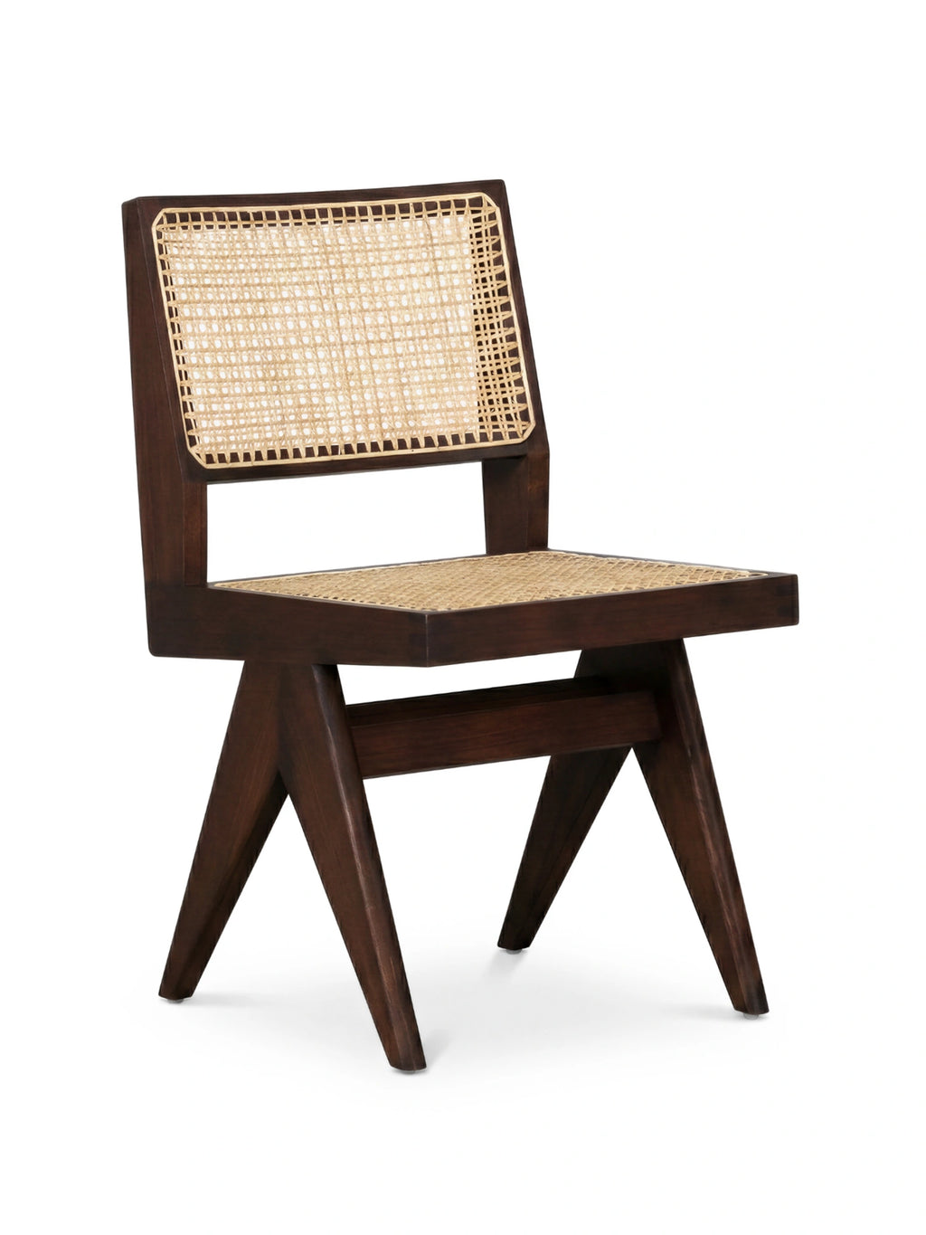 TCL Studios Capitol Cane Dining Chair, a mid-century modern dining chair crafted from dark brown solid wood with a natural hand-woven cane backrest and seat. It features a geometric, angular frame and distinctive V-shaped legs, embodying a brutalist design aesthetic. Ideal as a stylish dining room chair or accent furniture for contemporary and organic modern interiors.