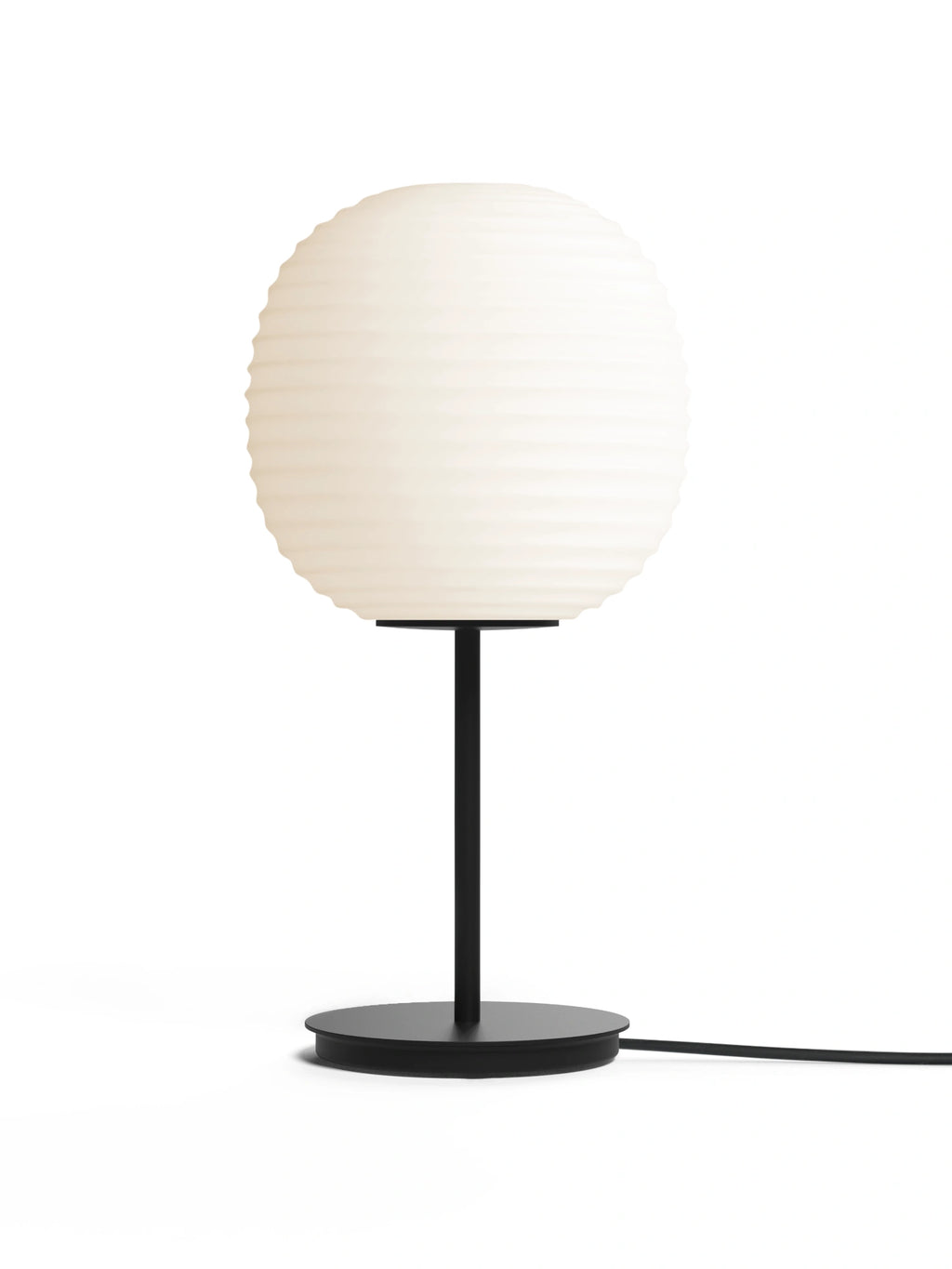 New Works Lantern Table Lamp on a clean white background. This premium designer lamp features a spherical, ribbed opal glass shade and a matte black metal stand and base with a black cord. A luxury lighting fixture for any modern interior.