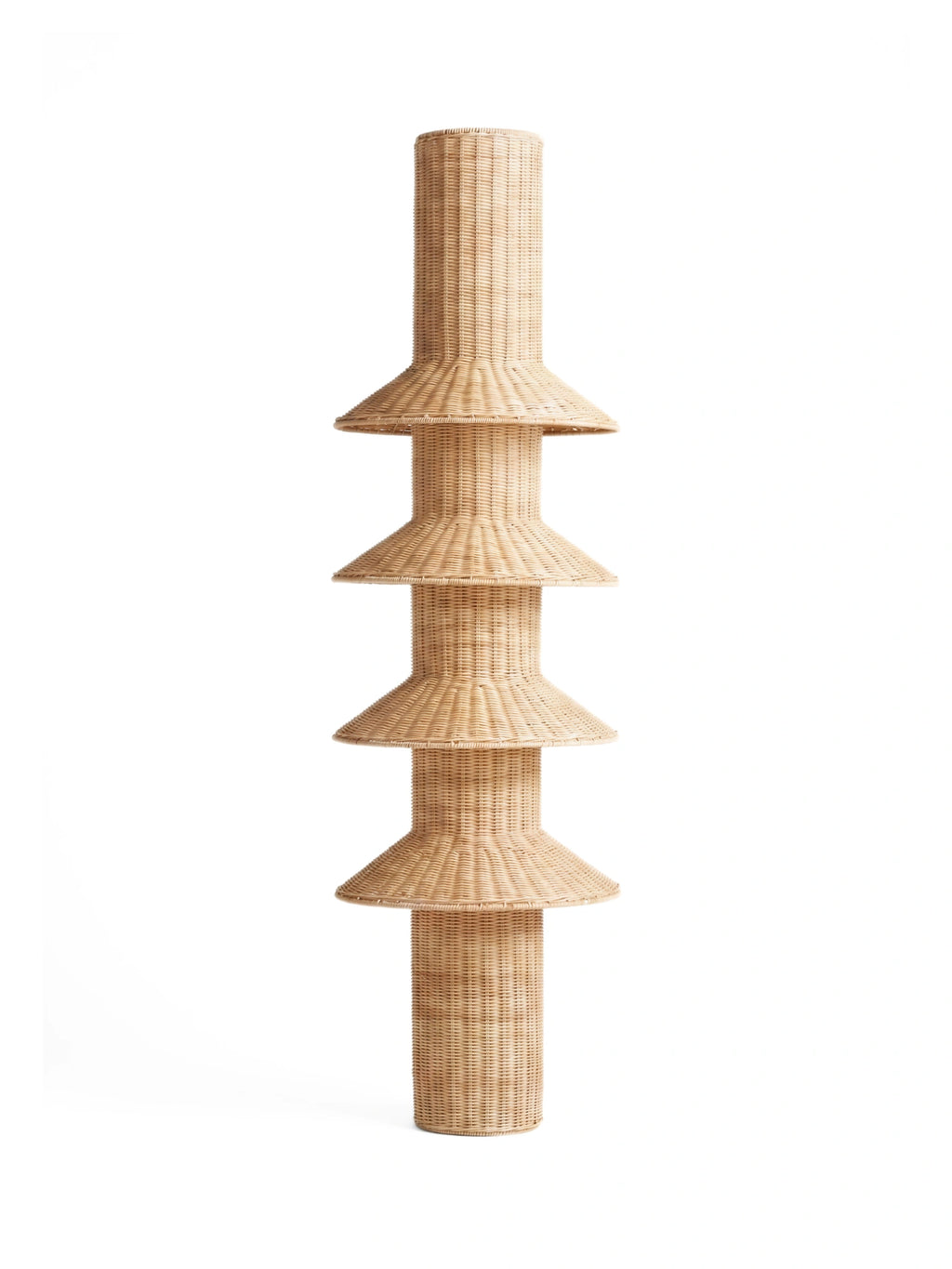 Heaps & Woods Rose Floor Lamp, a tall, sculptural natural rattan floor lamp featuring a light beige woven texture with a cylindrical base and top, punctuated by four stacked, bell-shaped tiers. This organic modern standing lamp offers a bohemian and coastal aesthetic, crafted from hand-woven rattan for a warm, inviting glow. Perfect as accent lighting for living rooms, bedrooms, or Japandi and Scandinavian-inspired interiors.