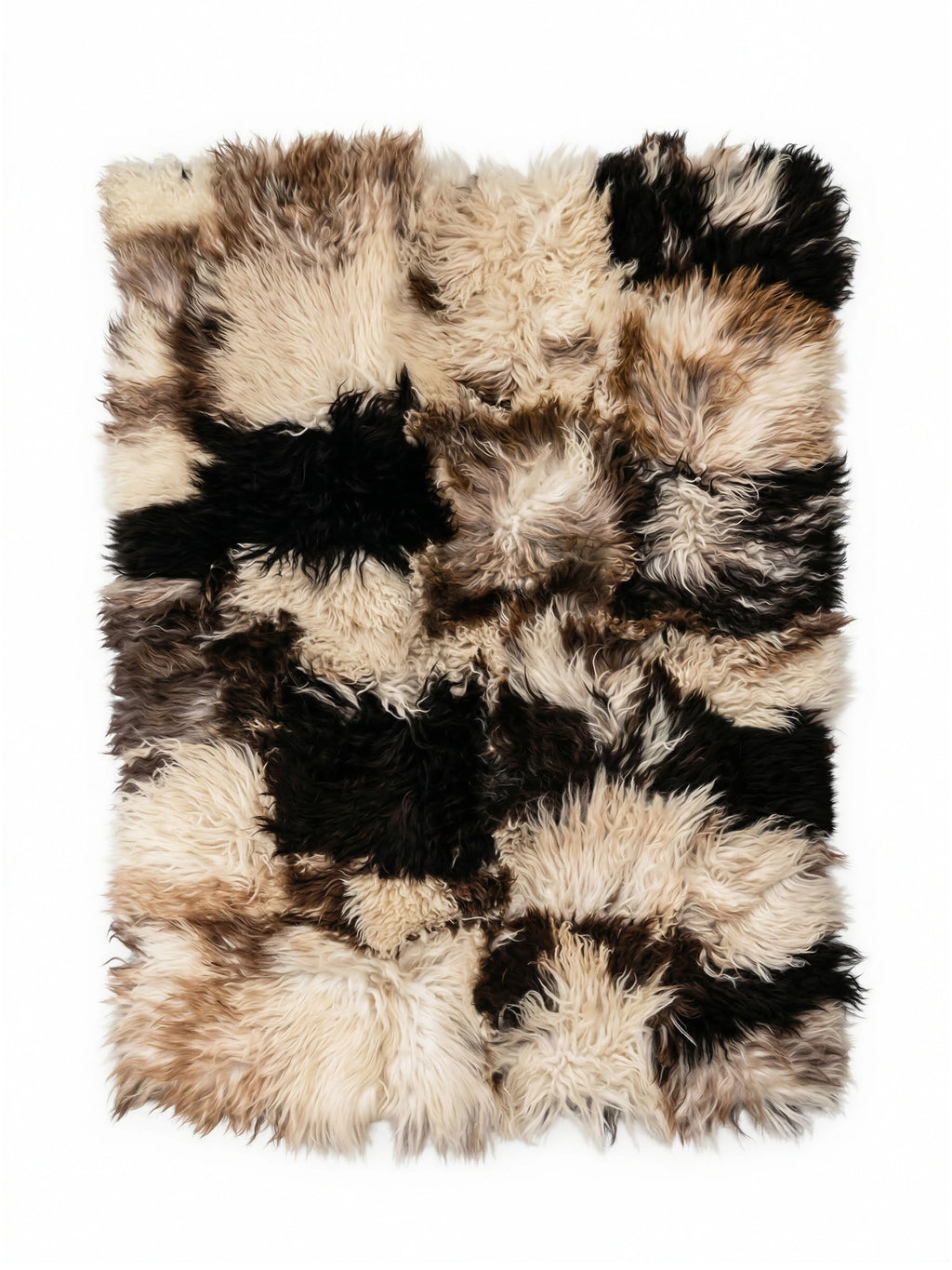 TCL Studios Curly Sheepskin Patchwork Rug, a luxurious shaggy area rug crafted from genuine curly sheepskin in a distinctive patchwork design, featuring natural tones of creamy off-white, rich browns, and.