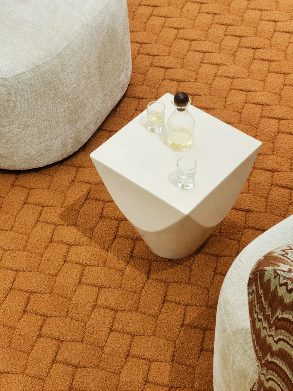 alp_ Palma Bicolor Rug, a plush textured area rug in a rich terracotta orange hue, featuring a distinctive raised geometric basketweave pattern and a soft, inviting pile. This warm tone rug is ideal for adding cozy, organic modern style to living rooms, bedrooms, or contemporary spaces.