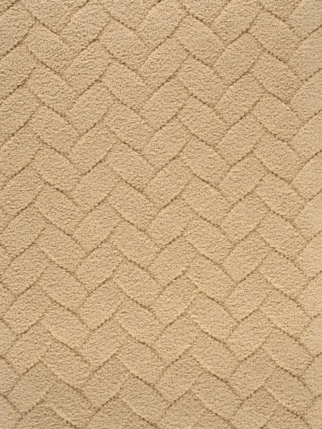 alp_ Palma Rug, a plush textured area rug in a soft natural beige color, featuring a raised herringbone pattern crafted from a dense, high-low pile.