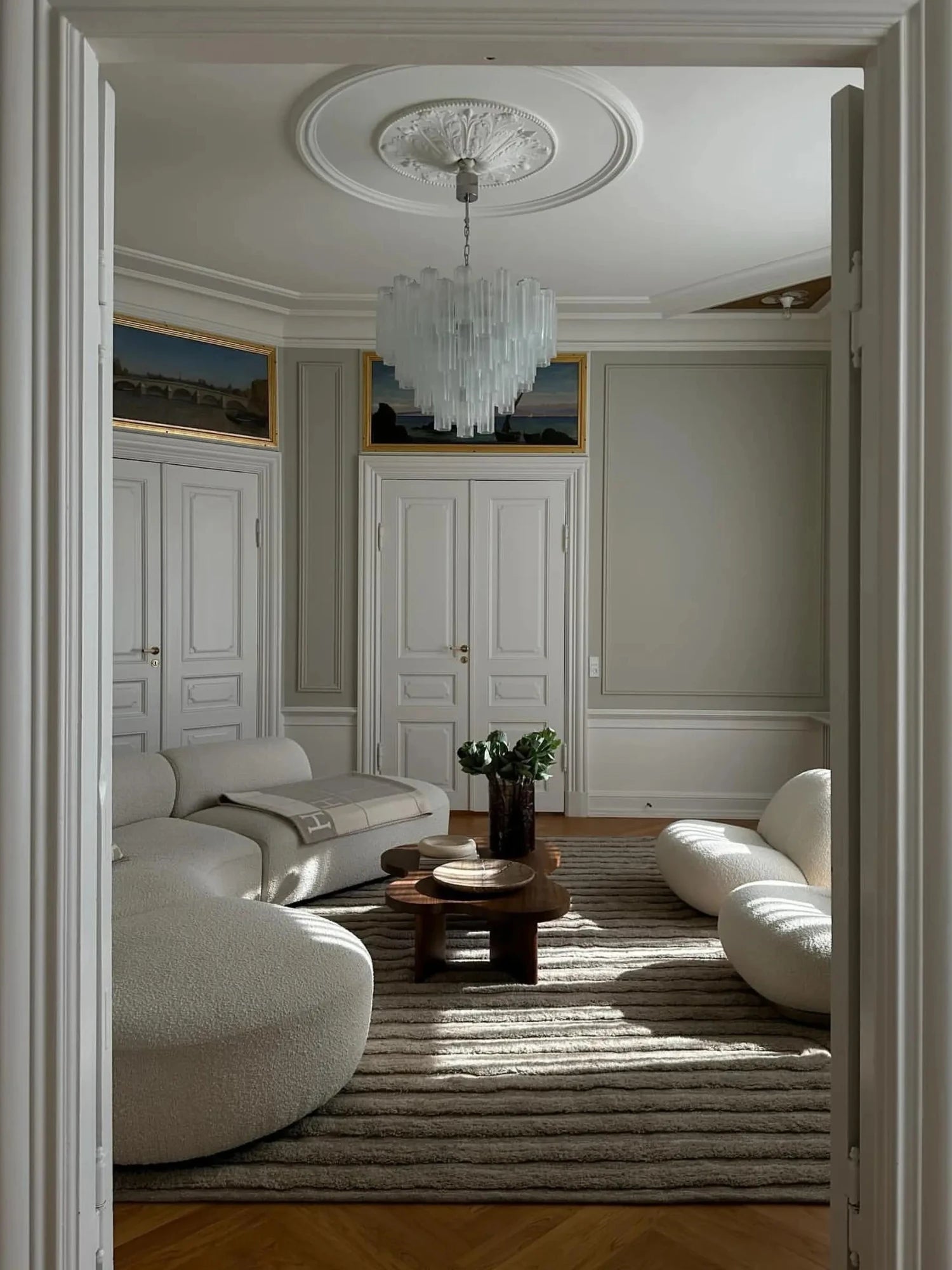 Tinted Objects Riklund Wool Rug, featuring a hand-tufted, textured gray wool with subtle horizontal ribbing. This stylish area rug adds warmth and modern elegance to any living room or bedroom.
