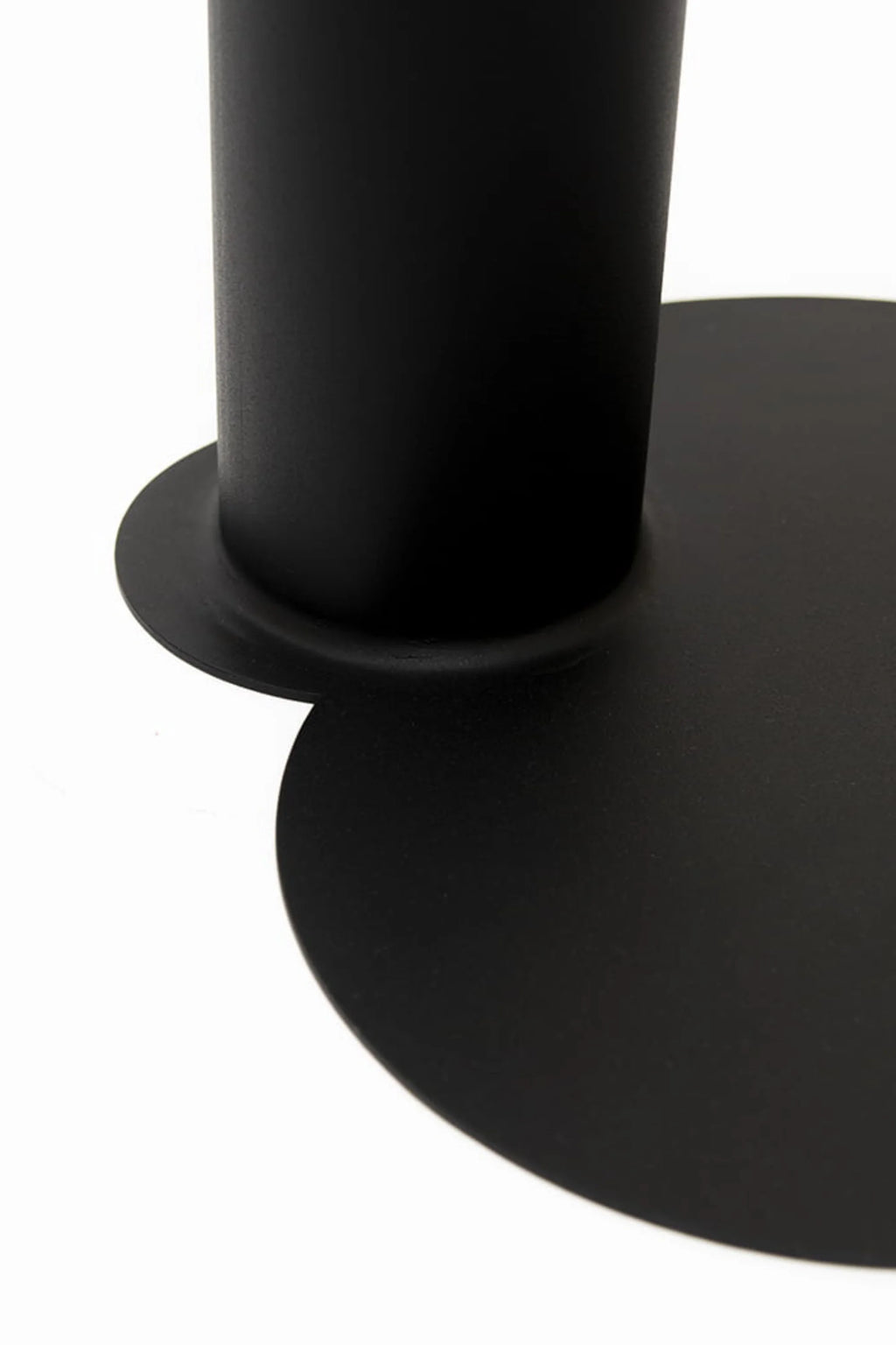 NG DESIGN Object 073 Side Table close-up, showcasing its sleek matte black metal cylindrical base connected to a round, flat tabletop. This modern, luxury piece is ideal for contemporary spaces.