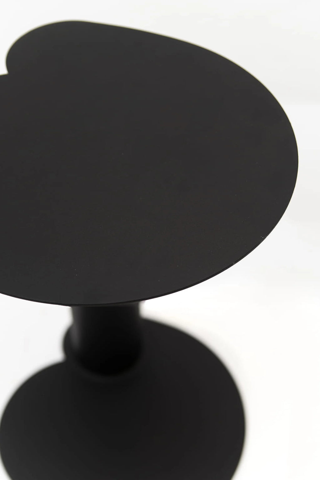 NG DESIGN Object 073 Side Table in matte black, showcasing its unique kidney-bean shaped top and sturdy conical base on a white background. This luxury, minimalist table is perfect for modern living spaces.