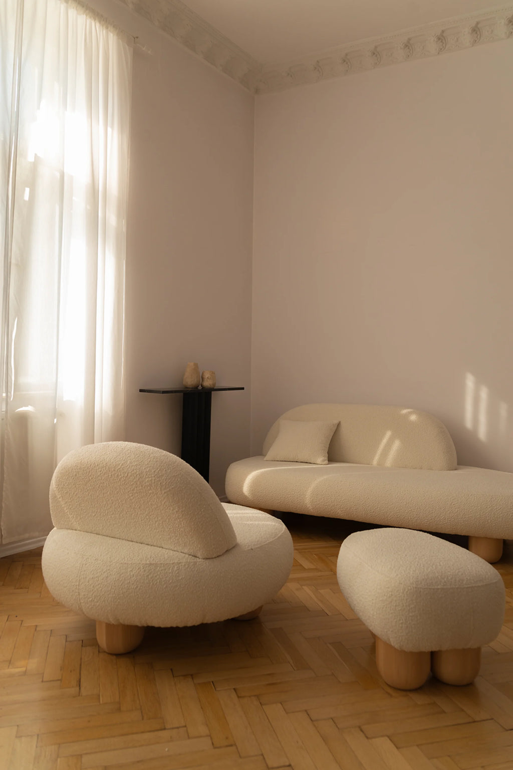 NG DESIGN Object 049 Pouf: A modern mushroom-shaped pouf in light beige textured boucle fabric with chunky wooden legs, displayed in a bright, minimalist living room. Creates a stylish accent.
