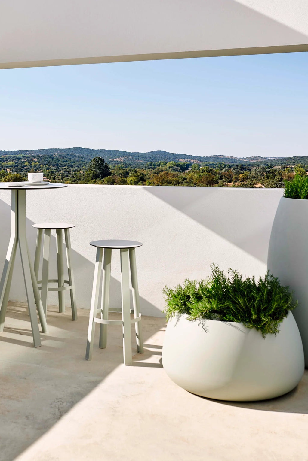 Gandia Blasco Sahara Outdoor Planter 4, a large, modern minimalist outdoor planter in a soft pale green finish with a smooth, matte texture and a distinctive organic, rounded pebble-like shape. This durable, contemporary garden planter is designed for weather resistance, making it perfect for adding sculptural greenery to stylish patios, terraces, and outdoor living spaces.