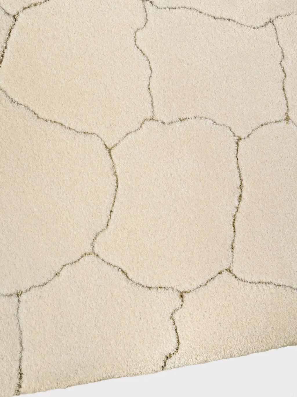 alp_ Saline Rug, a luxurious cream area rug featuring a plush, soft-pile texture with an organic, irregular cracked pattern in a contrasting low-pile light taupe, creating a unique dimensional.