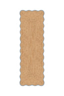 Rectangular jute rug with scalloped edge on a white background