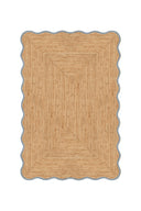 Beige braided rug on a white background
