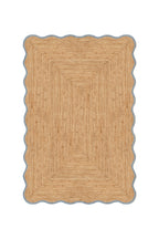 Beige braided rug on a white background