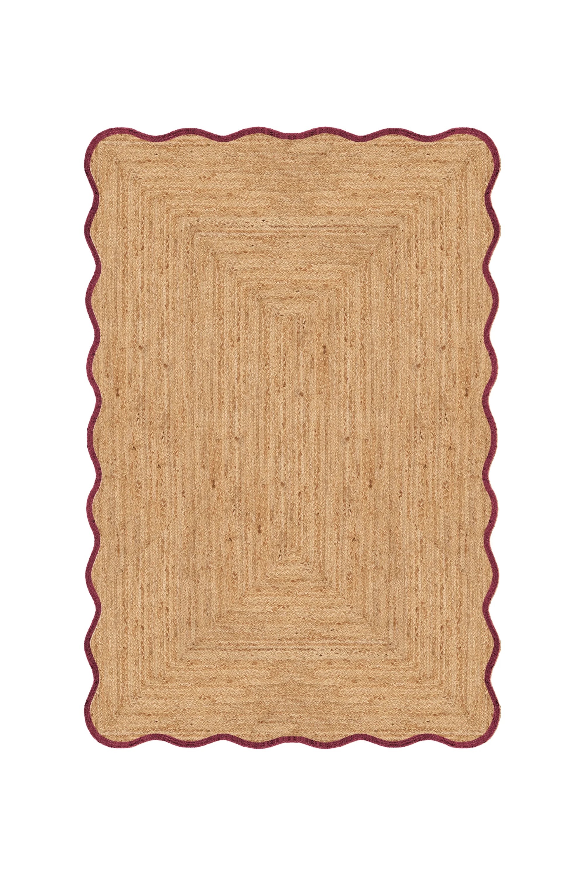 Beige braided rug with a scalloped edge on a white background