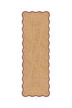 Rectangular braided rug with scalloped edge on a white background