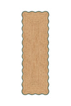 Rectangular jute rug with scalloped edge on a white background