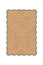 Beige braided rug with a scalloped edge on a white background
