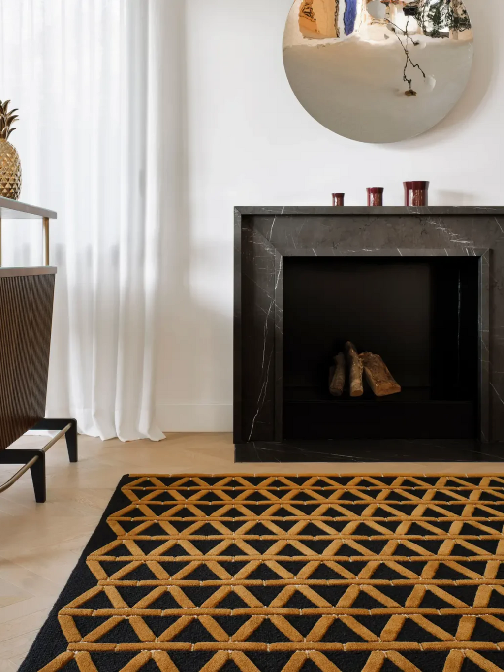 alp_ Secadero Rug, a striking contemporary area rug featuring a bold geometric pattern of raised golden yellow triangles against a deep black background, crafted with a plush, hand-tufted texture.