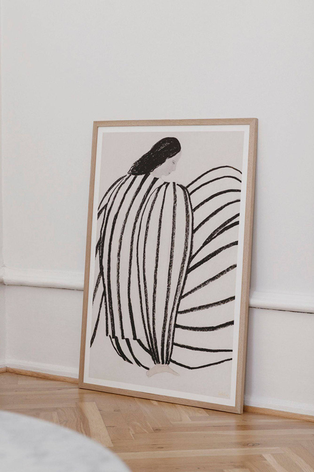 The Poster Club You, a striking modern minimalist abstract figurative art print featuring a seated figure rendered in bold, textured black stripes against a soft off-white background.
