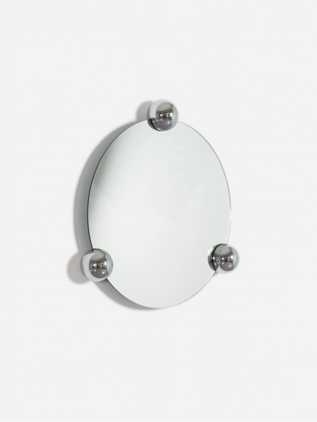 Moustache Sphera Orbit Mirror, a premium oval mirror with a clear reflective surface and three elegant chrome spherical mounts, casting a soft shadow on a pristine white background, showcasing its modern design.