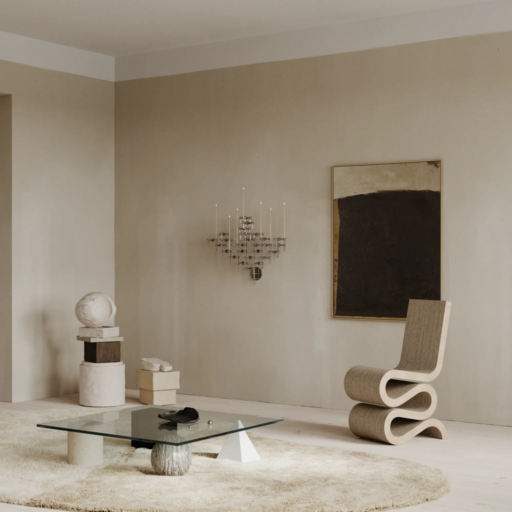 Stoff Nagel Wall Hanger Candle Holder - Chrome - Configuration 3, a striking mid-century modern wall-mounted candelabra crafted from polished chrome metal. Its modular, geometric design features interlocking pieces that create a sculptural, industrial chic statement piece for multiple taper candles. Perfect as a unique living room accent or brutalist-inspired dining room decor.