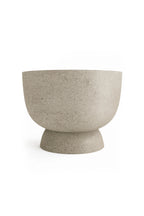Beige ceramic bowl on a white background