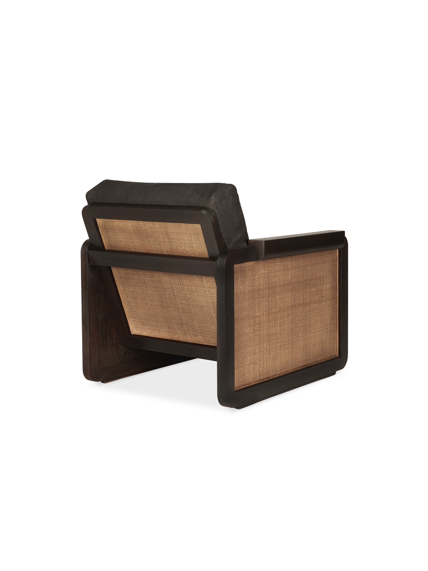 Ethnicraft Panel Lounge Chair, seen from the back, featuring a dark brown varnished teak frame, natural woven rattan side panels, and a plush dark grey linen fabric cushion, on white.