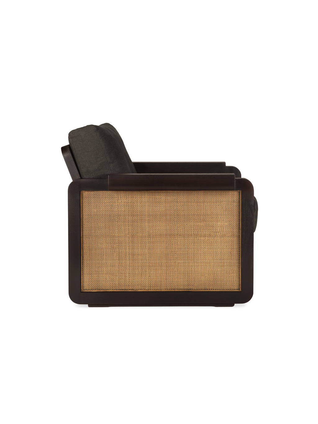 Ethnicraft Panel Lounge Chair, viewed from the side, showcasing its elegant dark brown varnished teak frame, textured natural rattan panel, and comfortable dark grey linen fabric cushion, on white.