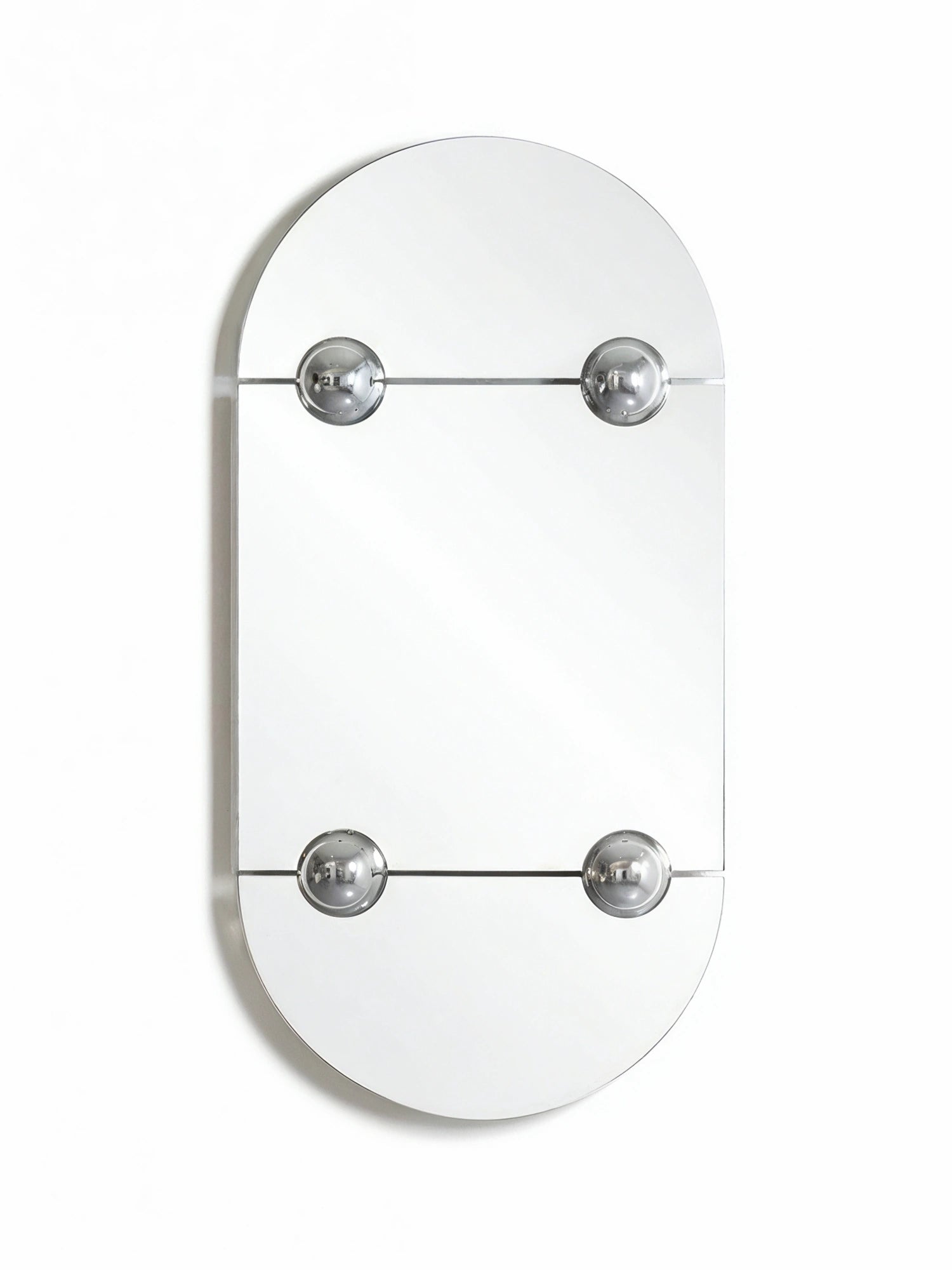 Moustache Sphera Oblong Mirror, a sleek, modern wall mirror with an elongated oval shape, featuring four polished chrome spherical fasteners that secure two rectangular mirror panels, creating a unique, contemporary design, displayed on a white wall.