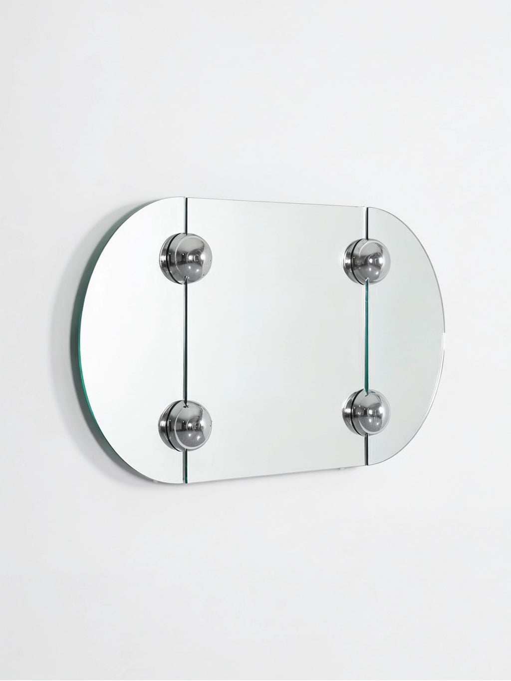 Moustache Sphera Oblong Mirror, a modern frameless glass mirror with rounded corners, secured by four polished chrome spherical fasteners, displayed on a clean white background.