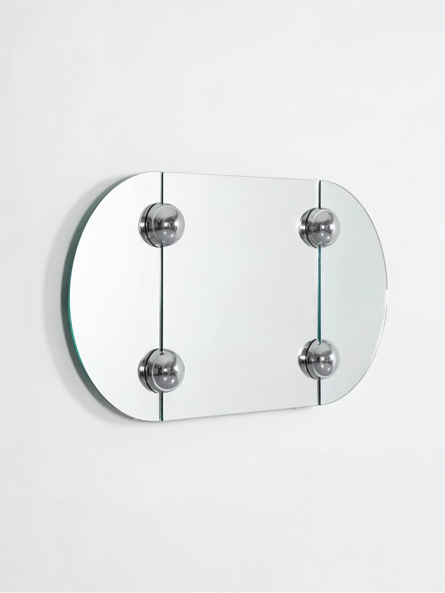 Moustache Sphera Oblong Mirror, a modern frameless glass mirror with rounded corners, secured by four polished chrome spherical fasteners, displayed on a clean white background.