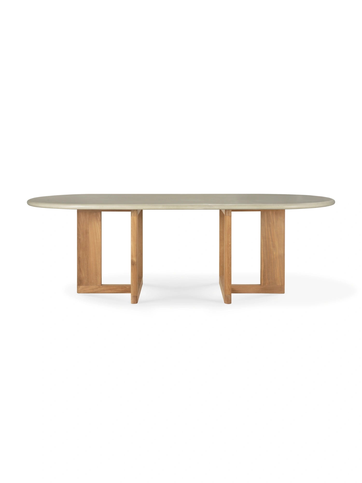 Ethnicraft Trestle Outdoor Dining Table, presented with its light grey oval concrete top and a solid reclaimed teak base, viewed from the front. The modern design and durable materials make it ideal for any patio.