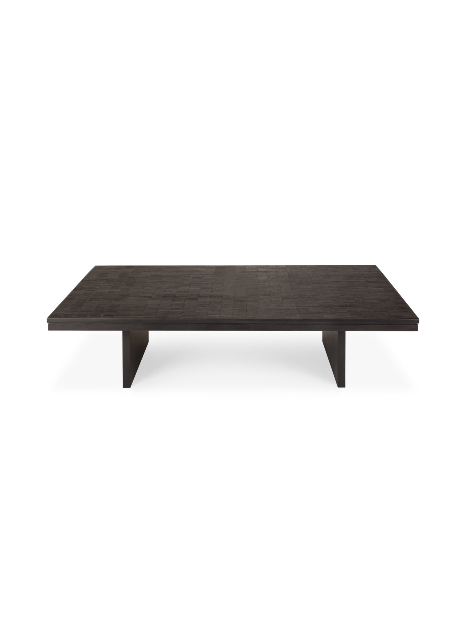 Ethnicraft Grooves Coffee Table, a long, rectangular design crafted from varnished Off-Black teak wood, featuring a textured surface with subtle linear grooves and two robust block legs, presented on a white background.