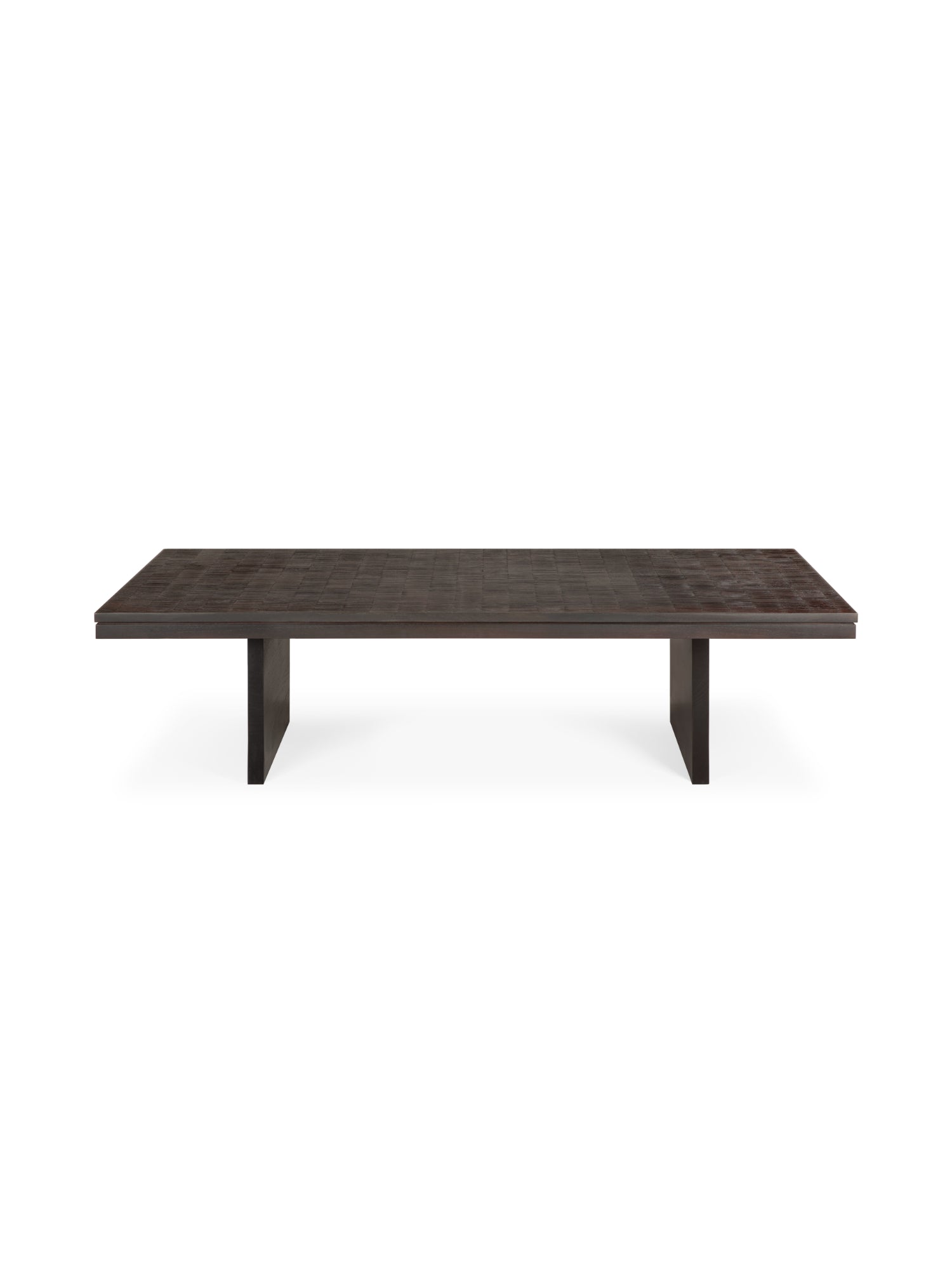 Ethnicraft Grooves Coffee Table, a long, rectangular design crafted from varnished Off-Black teak wood, featuring a textured surface with subtle linear grooves and two robust block legs, presented on a white background.