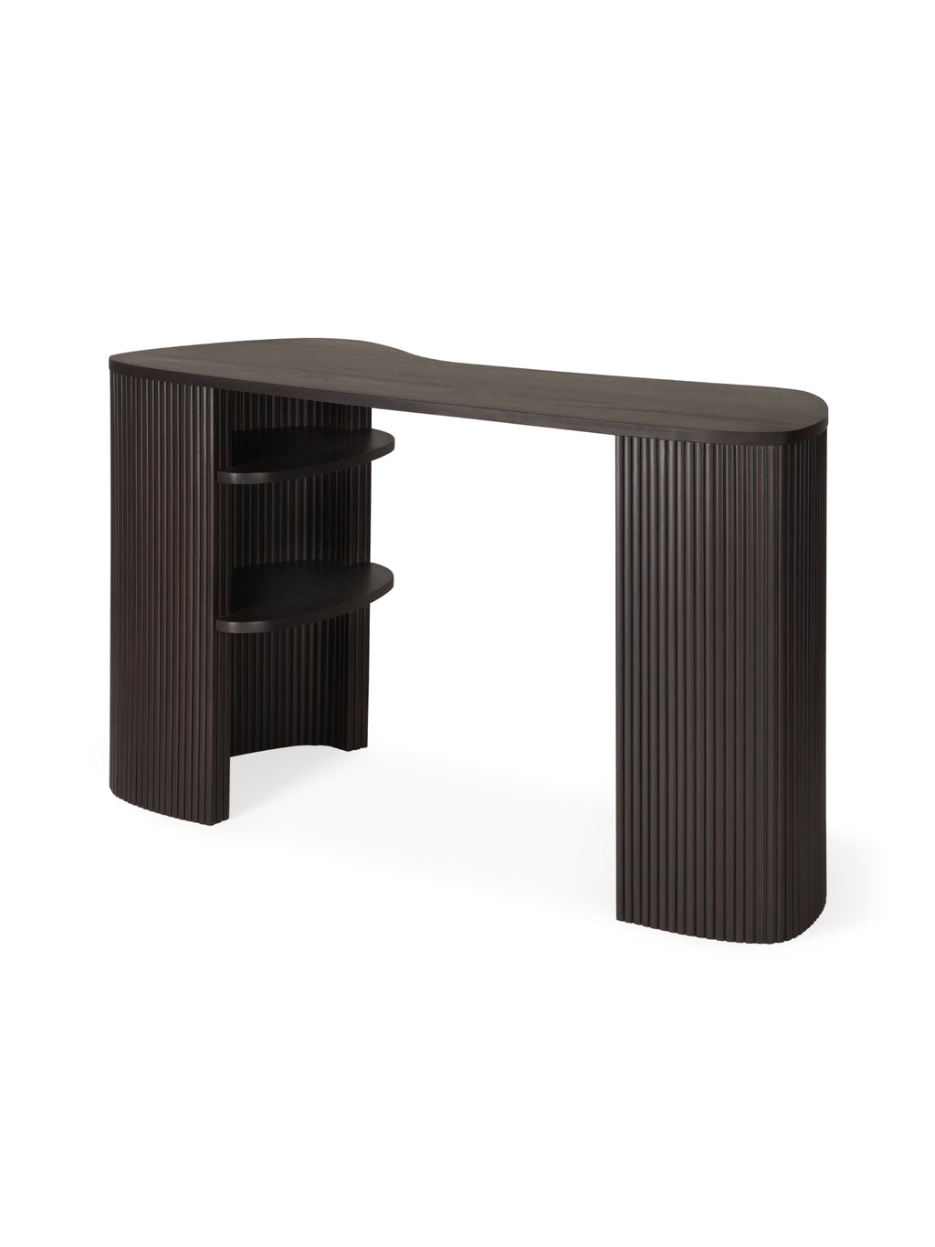 Ethnicraft Roller Max Desk, a sophisticated dark brown varnished mahogany desk with a fluted, textured design on its curved legs. This elegant and modern desk features integrated shelves on one side, presented from a side angle on a clean white background.