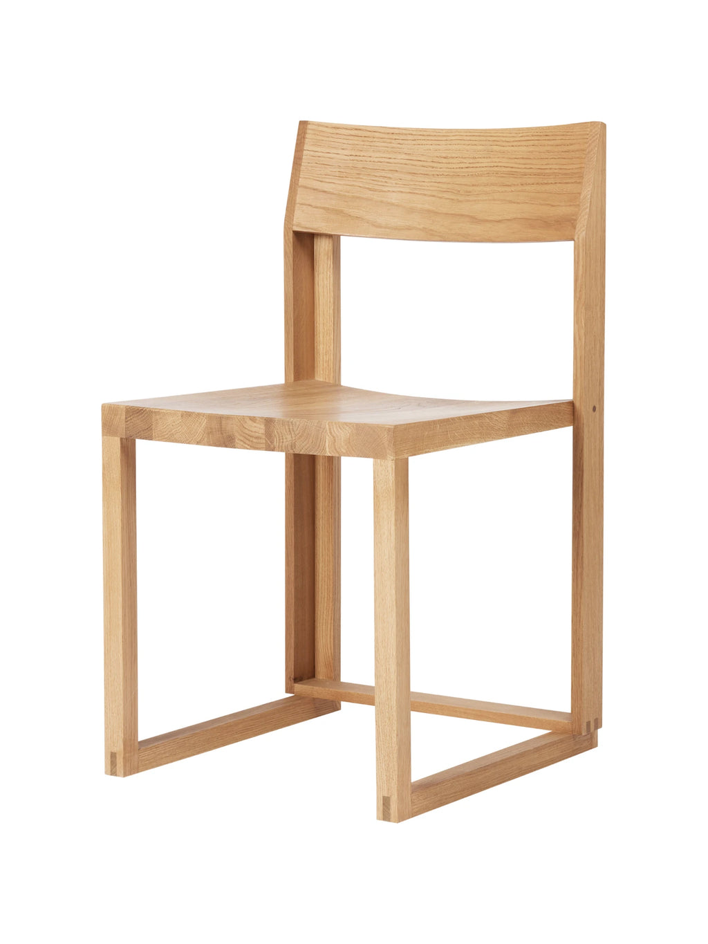 Kristina Dam Outline Chair, a minimalist solid oak dining chair crafted from natural light oak wood with a sturdy, geometric silhouette and visible finger joint detailing. This contemporary wooden chair features a clean-lined frame, a gently curved backrest, and a smooth seat, highlighting the beautiful natural grain. It's an ideal Scandinavian dining chair for modern minimalist kitchens or a sophisticated accent chair for Japandi-inspired living spaces.