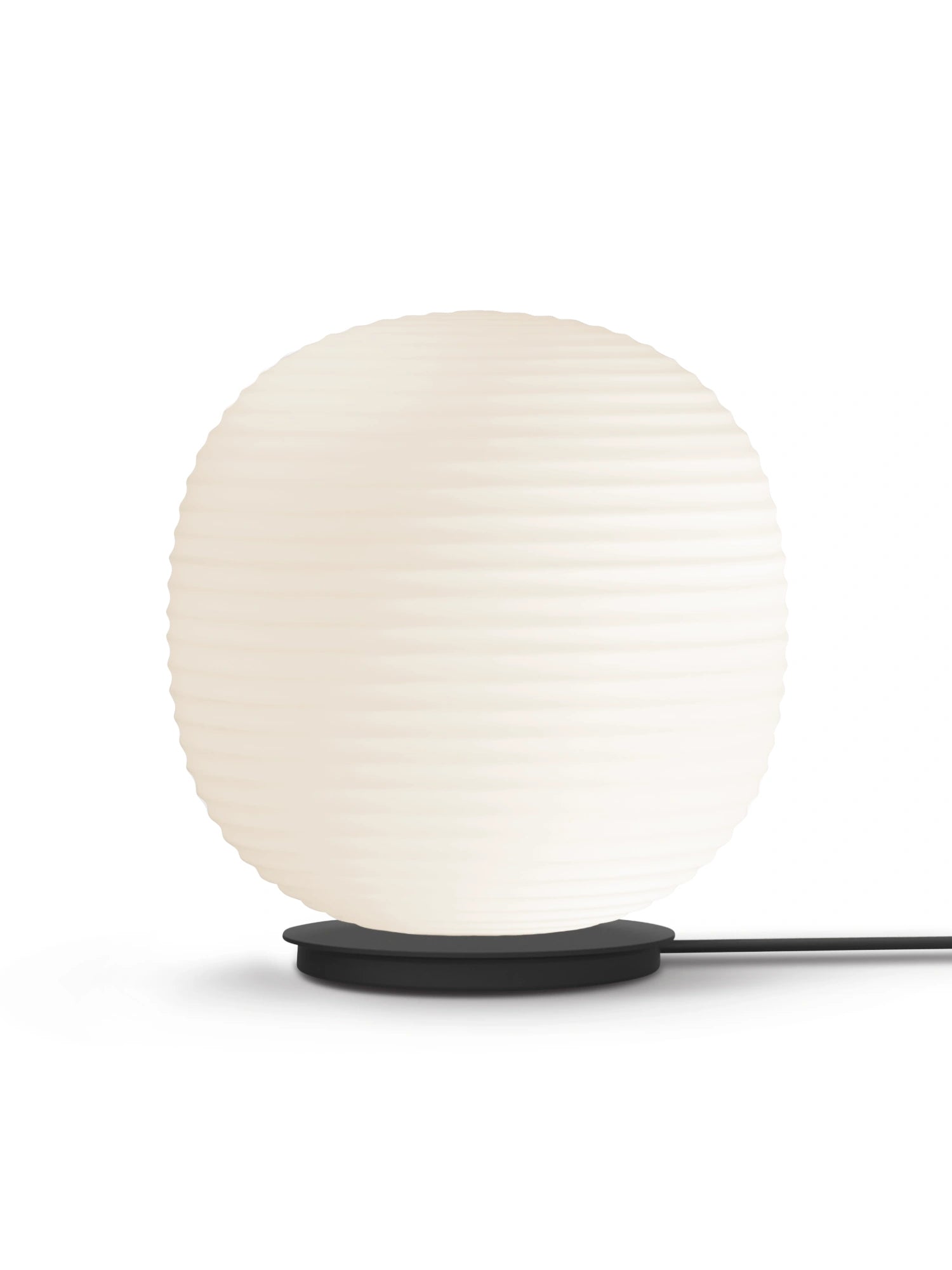 New Works Lantern Globe Floor Lamp with a luminous spherical white opal glass shade featuring ridged texture, resting on a sleek black metal base, shown on a white background. This premium designer lamp is ideal for modern interior lighting.