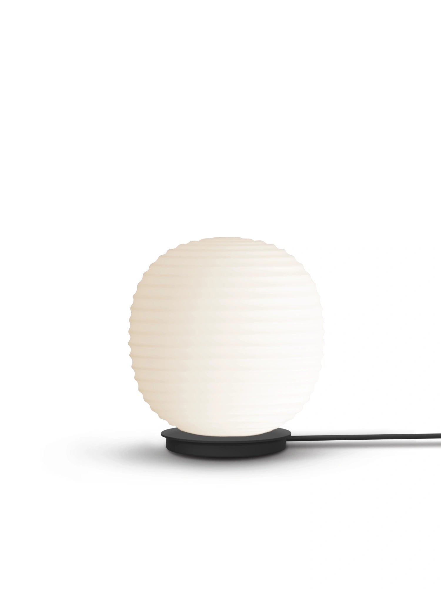 New Works Lantern Globe Floor Lamp, a premium white frosted glass spherical shade with subtle ribbed texture, resting on a sleek black metal base, shown on a white background. Ideal for modern interior lighting.