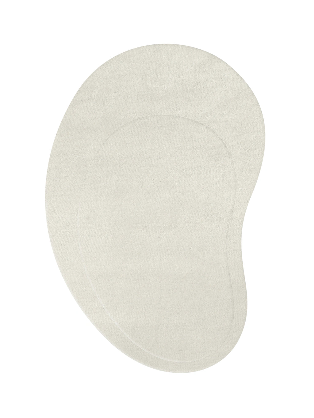 Layered Residue Wool Rug, an irregular organic-shaped area rug crafted from soft, natural undyed cream wool with a plush, textured pile. This minimalist, pebble-like rug adds an organic modern touch to Scandinavian living rooms, Japandi bedrooms, or contemporary entryways.