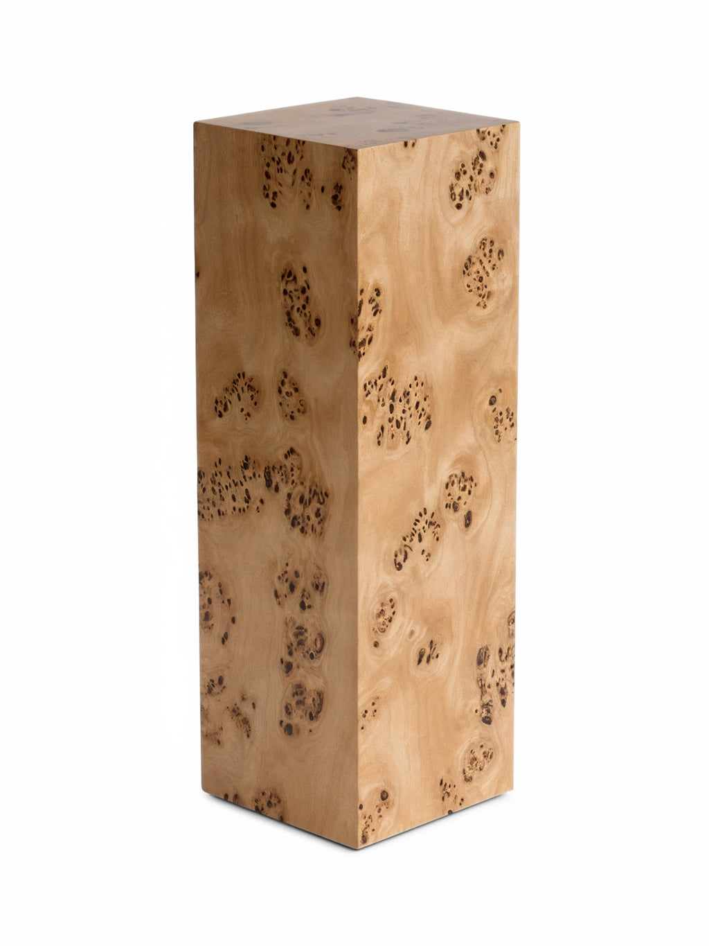TCL Studios Monolith Burlwood Display Column, a tall rectangular block crafted from exquisite natural burl wood, showcasing unique organic patterns of light beige and warm brown tones with distinctive dark knots and swirling grain.
