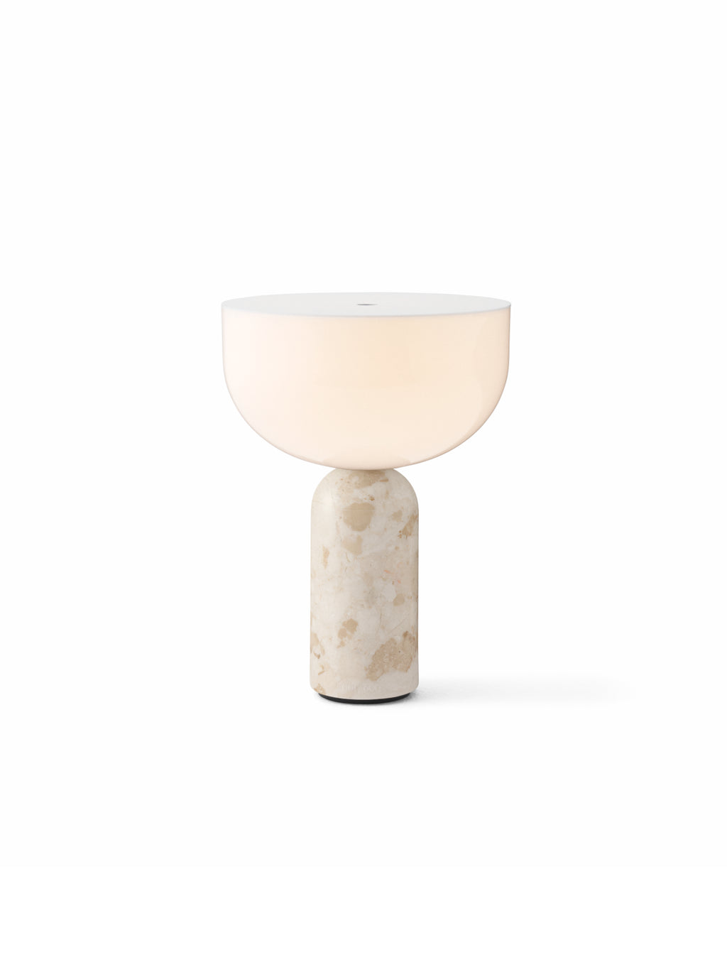 New Works Kizu Portable Table Lamp, featuring a unique half-sphere white acrylic diffuser casting a warm light atop a natural, textured beige marble base, perfect for accent lighting.