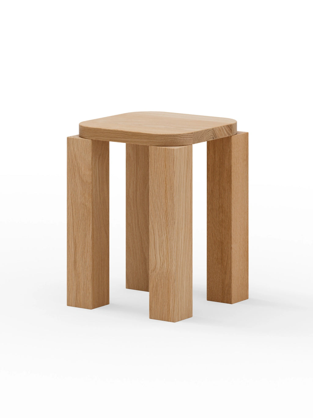 New Works Atlas Stool: Premium light oak wood stool with a thick, rounded square top and four robust rectangular legs, against a white background. Ideal for modern minimalist interiors.